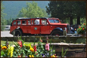 Classic red tour bus at Glacier Lodge